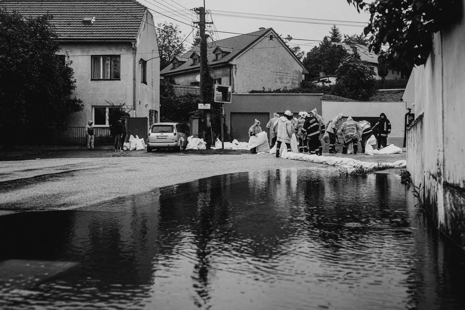 Workers responding to flooding in a residential area